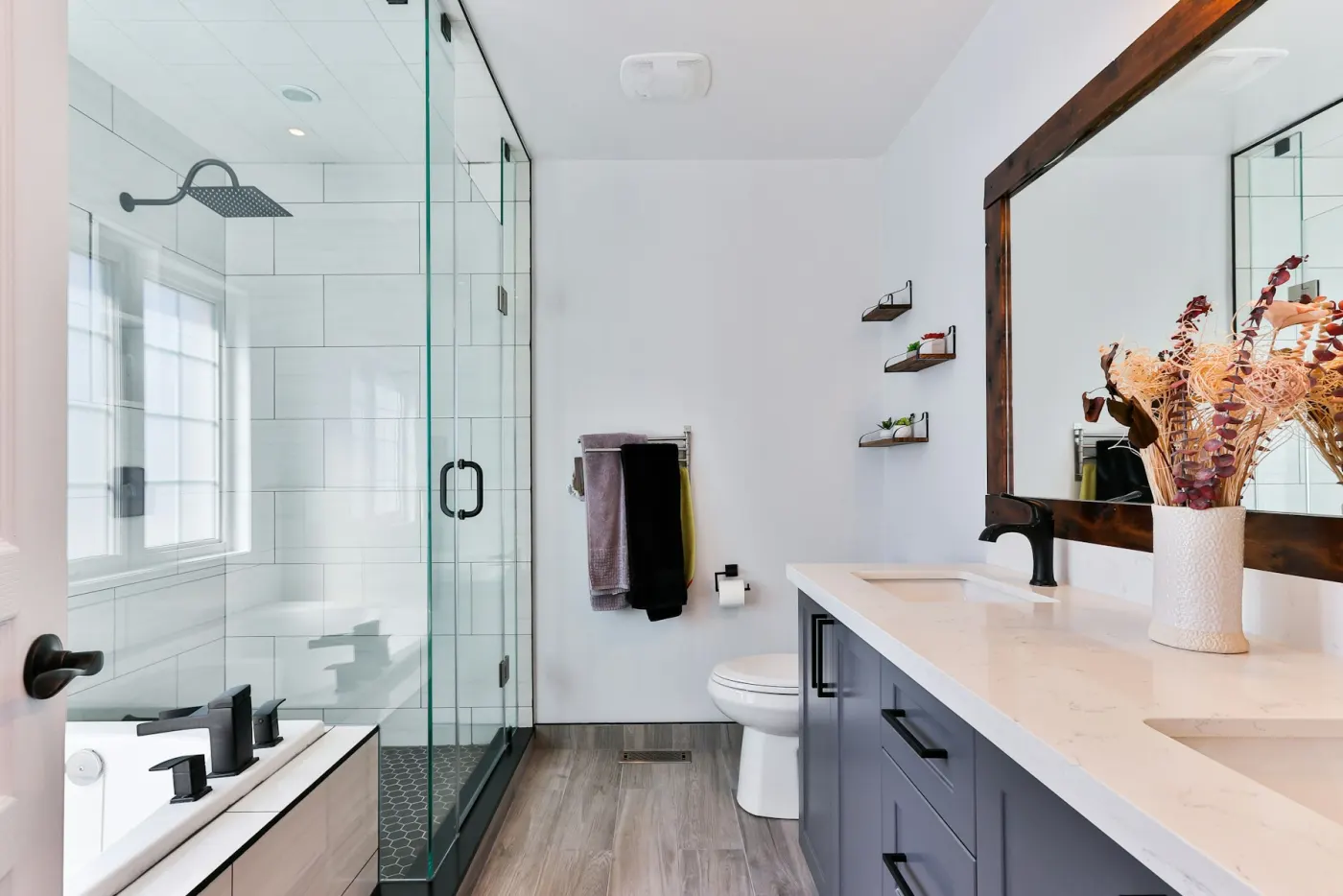 Toronto bathroom with glass shower and stone counter after a deep clean